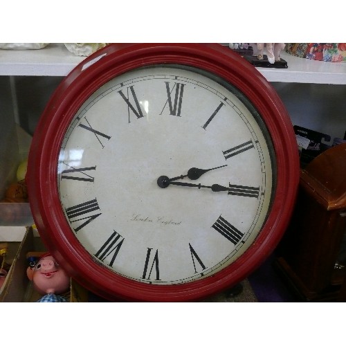 126 - A LARGE RED METAL WALL CLOCK LONDON ENGLAND