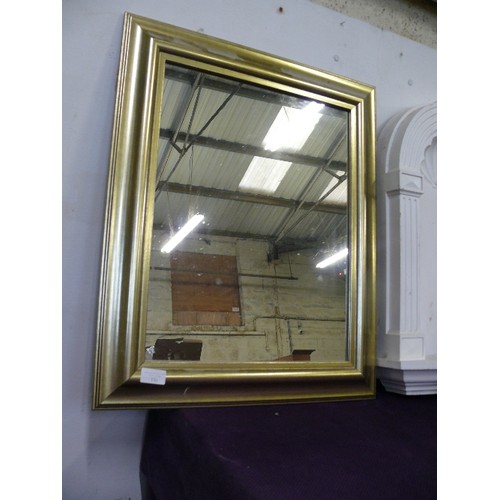 136 - A LARGE FRAMED WALL MIRROR