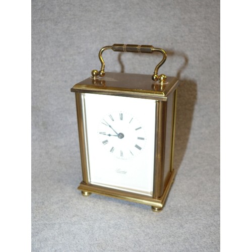 94 - A GOOD QUALITY BRASS CARRIAGE CLOCK BY LONSDALE