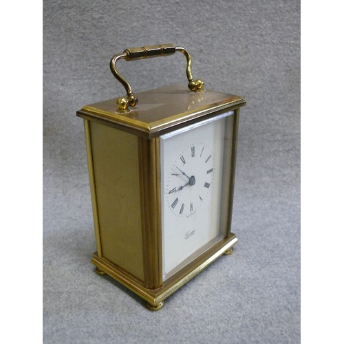 94 - A GOOD QUALITY BRASS CARRIAGE CLOCK BY LONSDALE