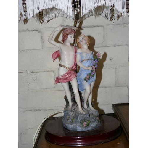 186 - A LARGE CERAMIC TABLE LAMP FEATURING A COUPLE WITH DECORATIVE SHADE