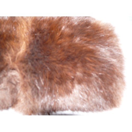 203 - A MINK MUFF IN VERY GOOD CONDITION