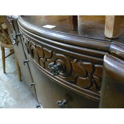 410 - LARGE VINTAGE SOLID BOW FRONTED SIDEBOARD, 4 CENTRAL DRAWERS, 2 CUPBOARDS AND HEAVY CARVED DETAIL