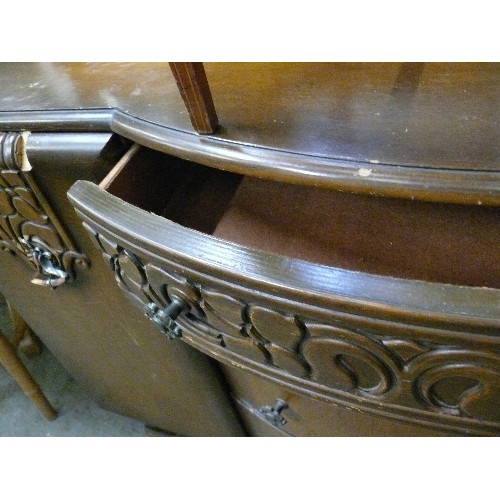 410 - LARGE VINTAGE SOLID BOW FRONTED SIDEBOARD, 4 CENTRAL DRAWERS, 2 CUPBOARDS AND HEAVY CARVED DETAIL