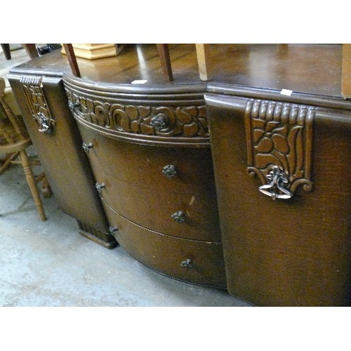 410 - LARGE VINTAGE SOLID BOW FRONTED SIDEBOARD, 4 CENTRAL DRAWERS, 2 CUPBOARDS AND HEAVY CARVED DETAIL