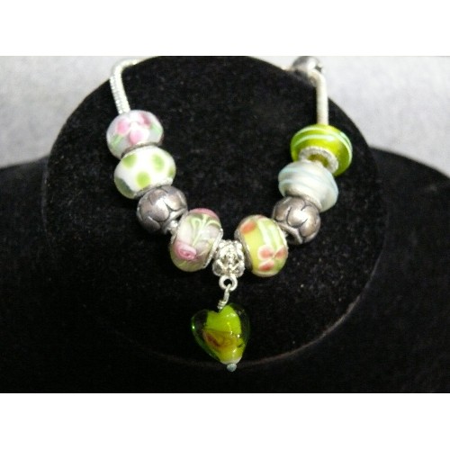 66 - A LOVELY PINK AND GREEN CHARM BRACELET WITH GLASS BEADS MARKED 925