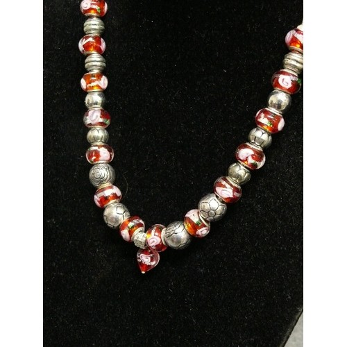 69 - A LOVELY PINK AND RED CHARM NECKLACE WITH GLASS  BEADS MARKED 925