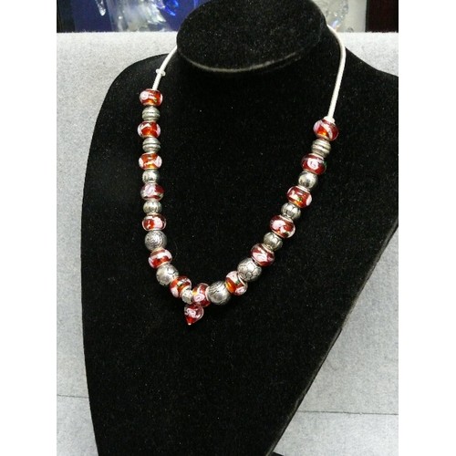 69 - A LOVELY PINK AND RED CHARM NECKLACE WITH GLASS  BEADS MARKED 925