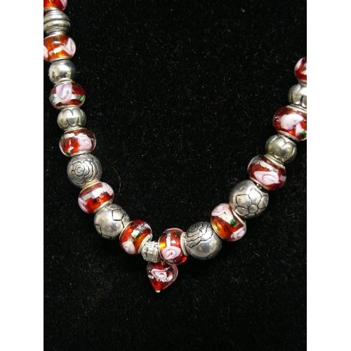 69 - A LOVELY PINK AND RED CHARM NECKLACE WITH GLASS  BEADS MARKED 925