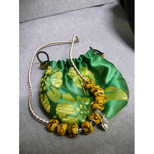 65 - A LOVELY LEATHER CHARM NECKLACE WITH  YELLOW MARBLED BEADS MARKED 925