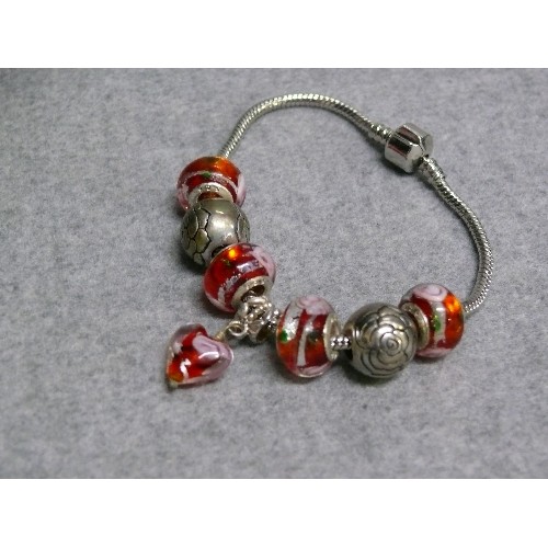 64 - A LOVELY PINK AND RED CHARM BRACELET WITH GLASS BEADS MARKED 925