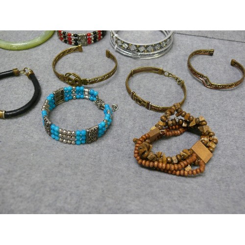 61 - A NICE COLLECTION OF BANGLES AND BRACELETS, SOME PERUVIAN METALWORK