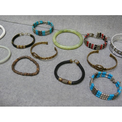 61 - A NICE COLLECTION OF BANGLES AND BRACELETS, SOME PERUVIAN METALWORK