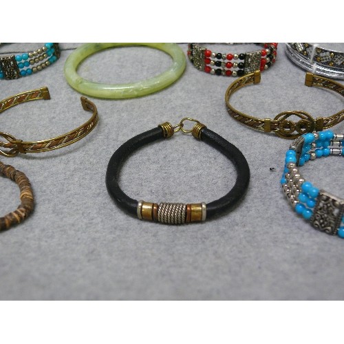 61 - A NICE COLLECTION OF BANGLES AND BRACELETS, SOME PERUVIAN METALWORK