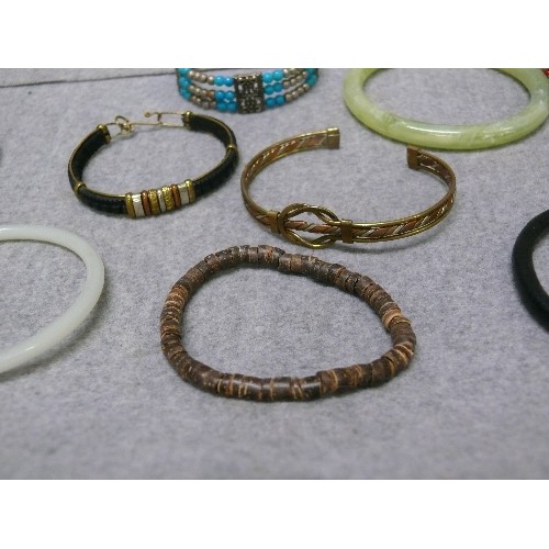 61 - A NICE COLLECTION OF BANGLES AND BRACELETS, SOME PERUVIAN METALWORK