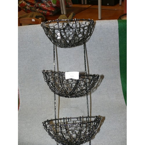 125 - A BLACK METAL WALL HANGING BASKET WITH CHICKEN MOTIF AND A CANDLEHOLDER