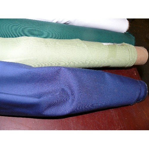 153 - 4 PART ROLLS OF FABRIC PALE GREEN, DARK GREEN, NAVY BLUE AND WHITE