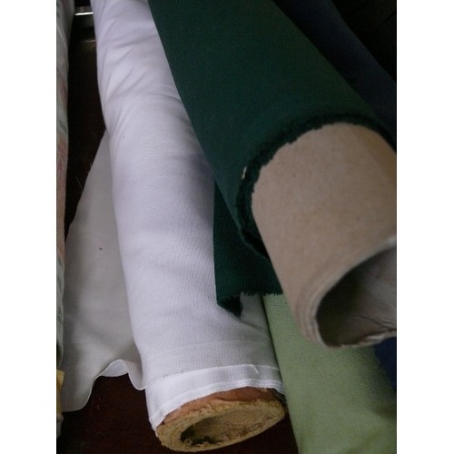 153 - 4 PART ROLLS OF FABRIC PALE GREEN, DARK GREEN, NAVY BLUE AND WHITE