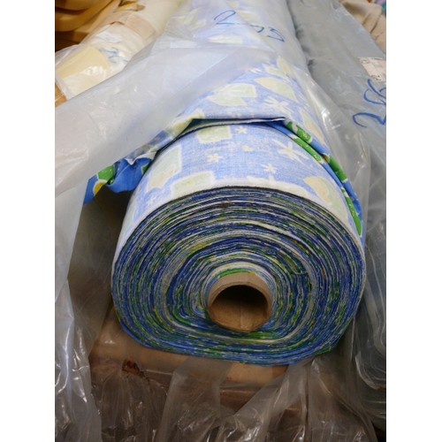 205 - A LARGE ROLL OF BLUE FABRIC WITH GREEN AND YELLOW FLORAL PATTERN