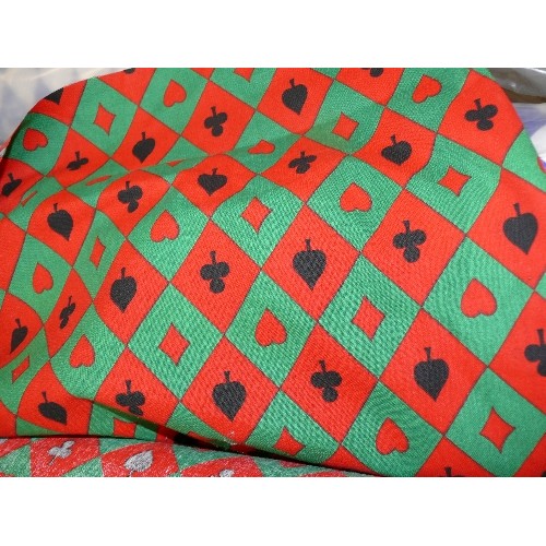 212 - A LARGE ROLL OF RED AND GREEN PLAYING CARD FABRIC