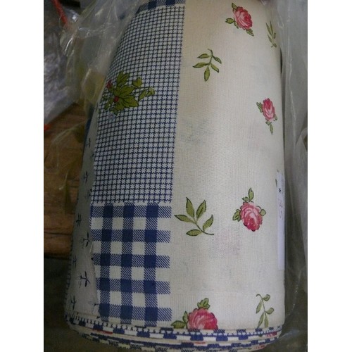 219 - A ROLL OF BLUE GINGHAM AND PINK ROSE FABRIC