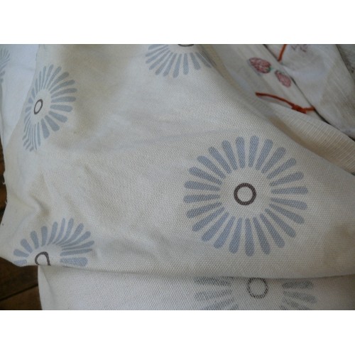 220 - A LARGE ROLL OF BLUE CIRCLE FABRIC