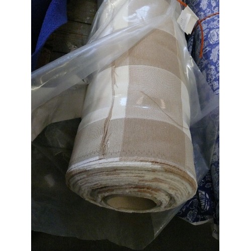 230 - A LARGE ROLL OF CREAM AND SAND COLOURED SQUARE FABRIC