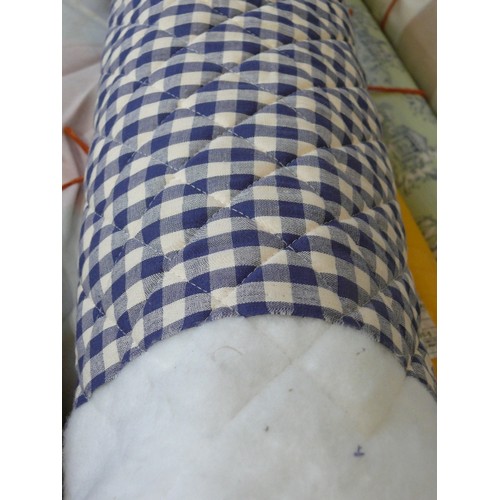 231 - A PART ROLL OF BLUE GINGHAM QUILTED FABRIC