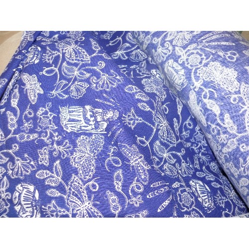 234 - A LARGE ROLL OF BLUE AND WHITE LACE DESIGN  FABRIC