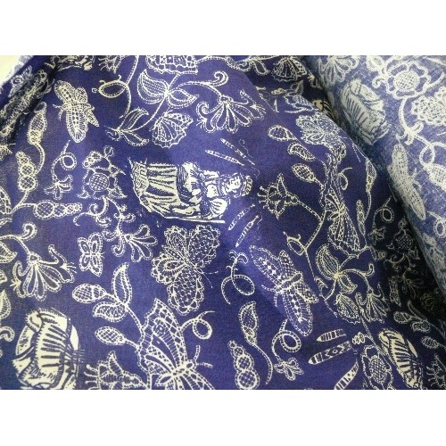 234 - A LARGE ROLL OF BLUE AND WHITE LACE DESIGN  FABRIC