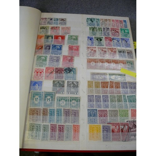 134 - A COLLECTION OF 6 FULL WORLD STAMP ALBUMS WITH A LARGE QUANTITY OF STAMPS