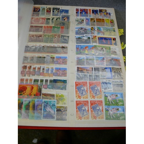 134 - A COLLECTION OF 6 FULL WORLD STAMP ALBUMS WITH A LARGE QUANTITY OF STAMPS