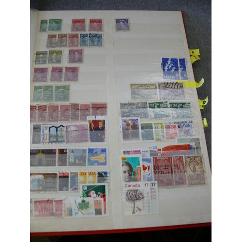 134 - A COLLECTION OF 6 FULL WORLD STAMP ALBUMS WITH A LARGE QUANTITY OF STAMPS