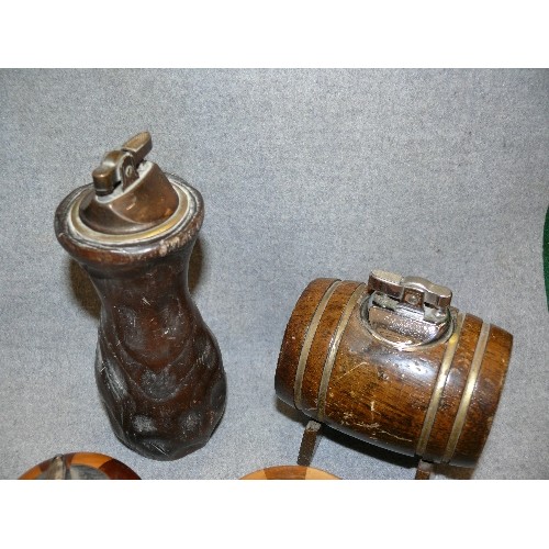 144 - 4 GOOD QUALITY CARVED WOODEN TABLE LIGHTERS