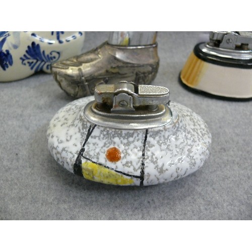 145 - 3 CERAMIC TABLE LIGHTERS AND A DECORATIVE PEWTER TABLE LIGHTER