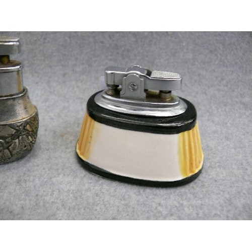 145 - 3 CERAMIC TABLE LIGHTERS AND A DECORATIVE PEWTER TABLE LIGHTER