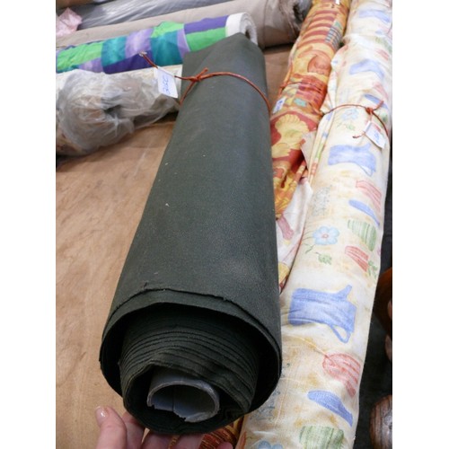 215C - A LARGE ROLL OF DARK GREEN CANVAS FABRIC