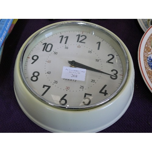 268 - A ROUND RETRO CREAM WALL CLOCK