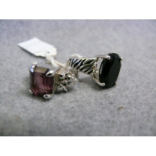 31 - TWO SOLID SILVER  SINGLE STONE RINGS 1 BLACK STONE SIZE O  AND A PURPLE SIZE N