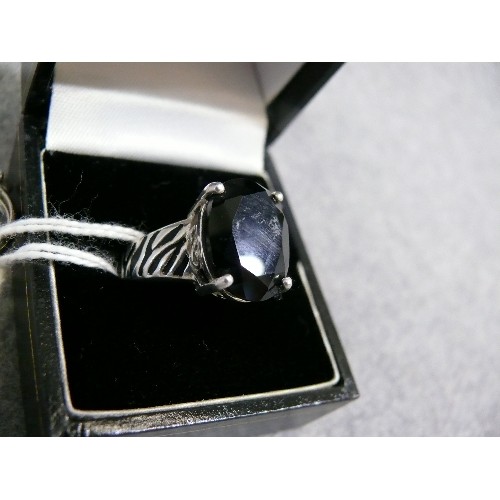 31 - TWO SOLID SILVER  SINGLE STONE RINGS 1 BLACK STONE SIZE O  AND A PURPLE SIZE N