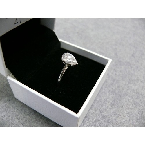 41 - A SOLID SILVER DRESS RING WITH BRIGHT CUT TEARDOP STONE