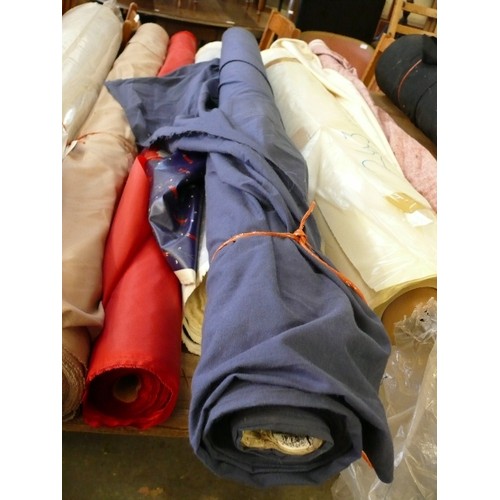 244 - A LARGE ROLL OF NAVY BLUE COLOURED FABRIC