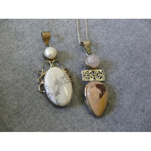 49 - TWO SILVER HEAVY PENDANTS WITH A PINK CRYSTAL AND STONE THE OTHER A PEARL AND STONE BOTH ON SILVER C... 