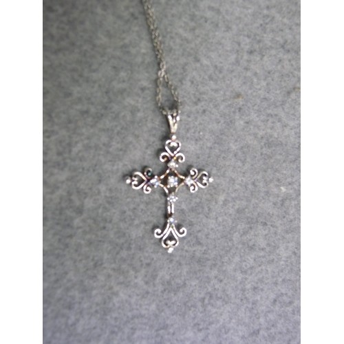 48 - A SUPER SILVER SPANISH TYPE CROSS ON SILVER CHAIN