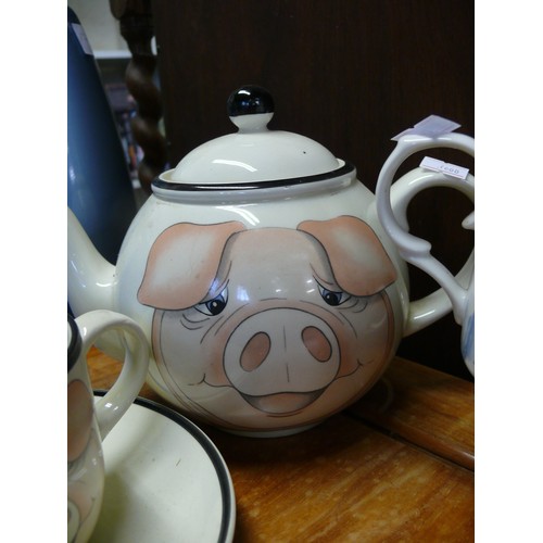 344A - PIG MOTIF TEAPOT WITH MATCHING CUP AND SAUCER PLUS A ONE PERSON TEAPOT/CUP