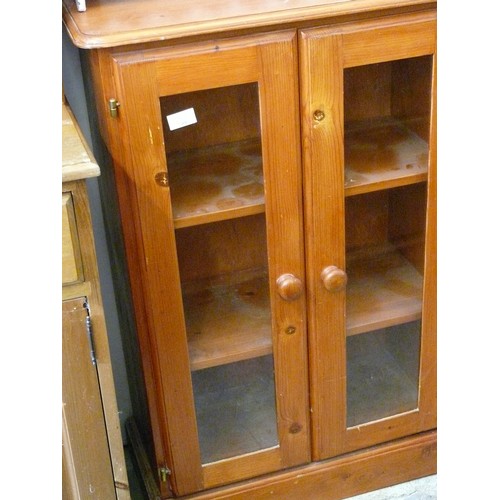 406 - NARROW PINE CUPBOARD WITH GLASS DOOR FRONTS