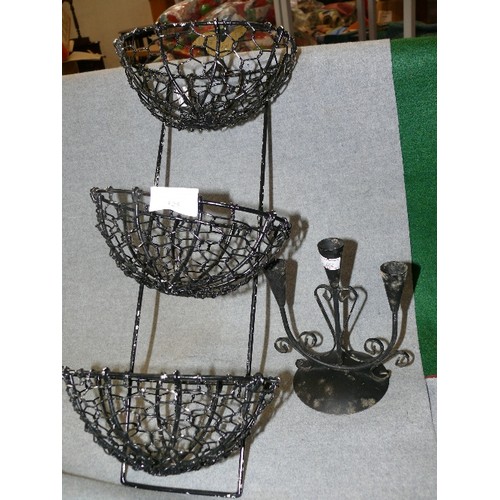 125 - A BLACK METAL WALL HANGING BASKET WITH CHICKEN MOTIF AND A CANDLEHOLDER