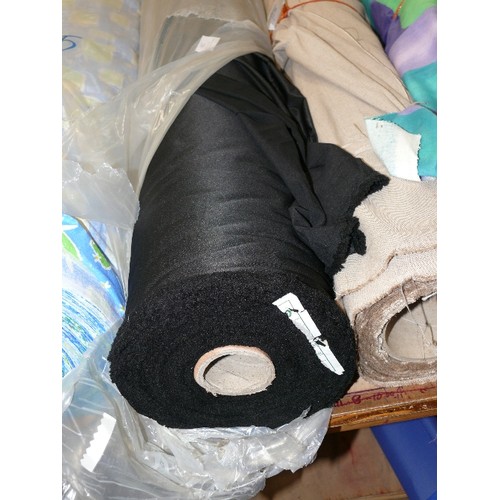 206 - A LARGE ROLL OF BLACK SILKY FABRIC