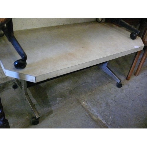 374 - A VINTAGE 'FORMICA' TOPPED COFFEE TABLE WITH METAL LEGS ON CASTORS