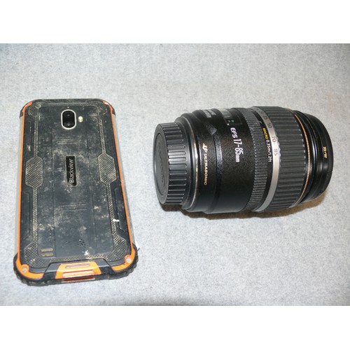 69 - AN ANDROID SMART PHONE PLUS A CANON CAMERA LENS